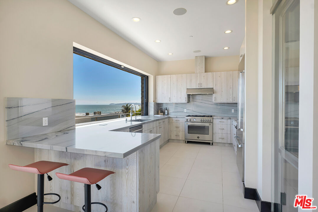 Expansive Ocean and City Light Views