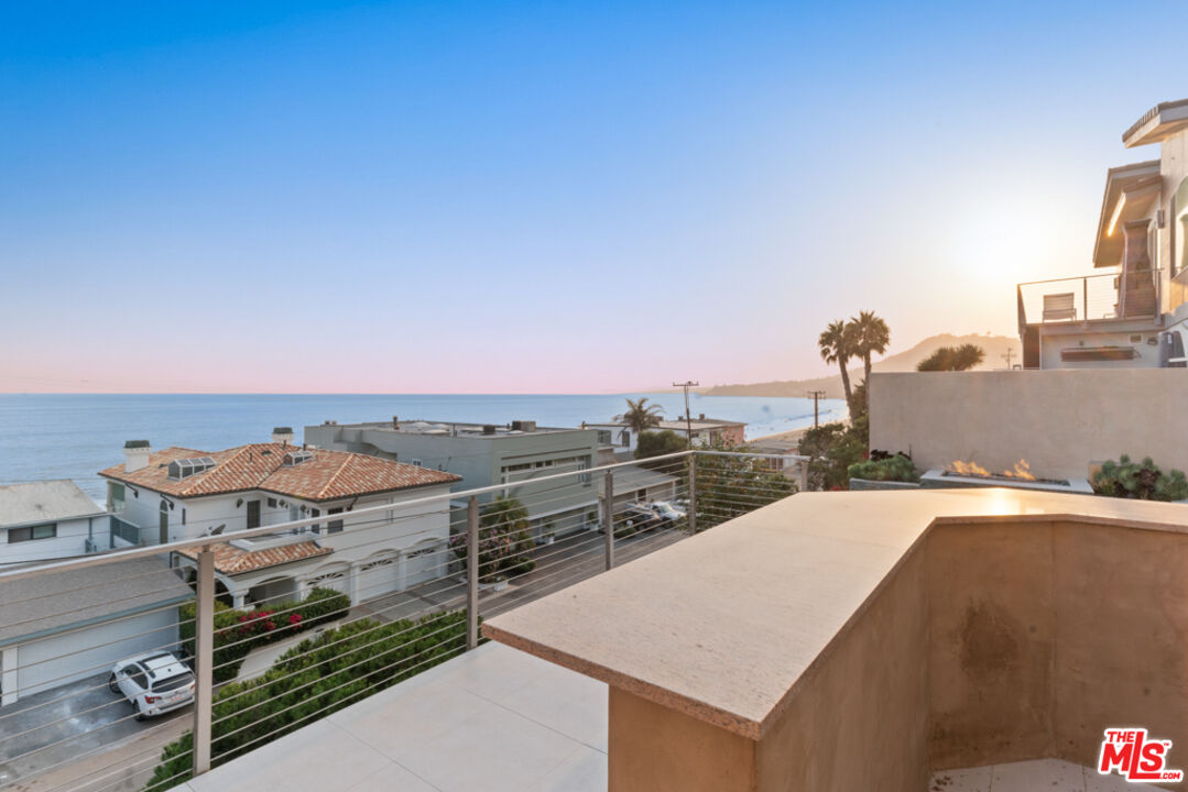 Expansive Ocean and City Light Views