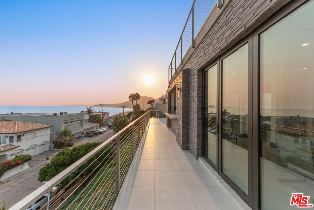 Expansive Ocean and City Light Views