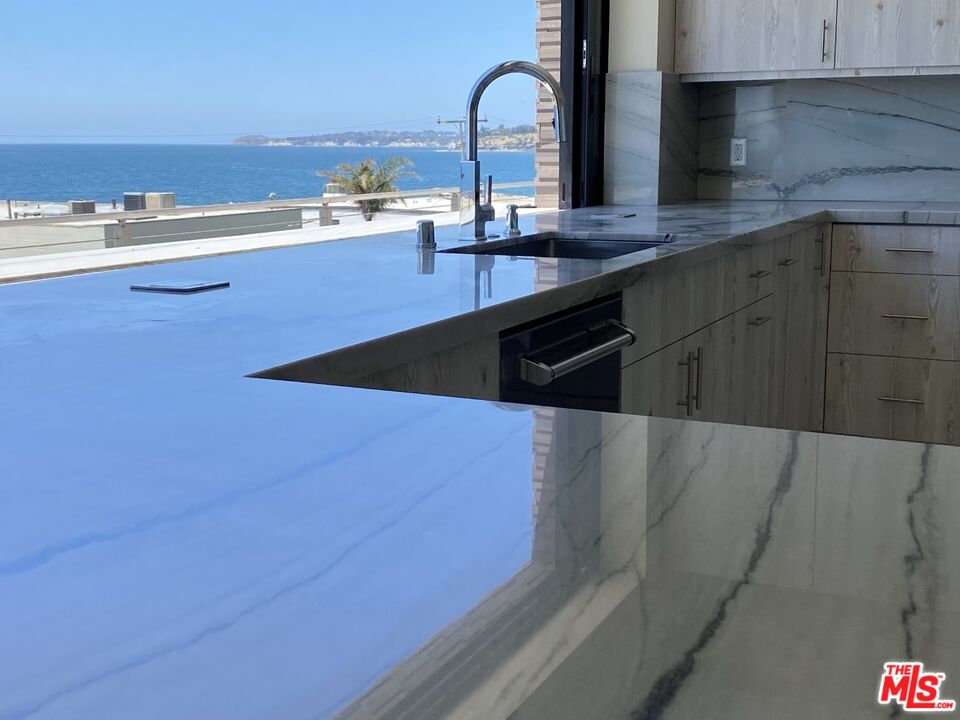 Expansive Ocean and City Light Views