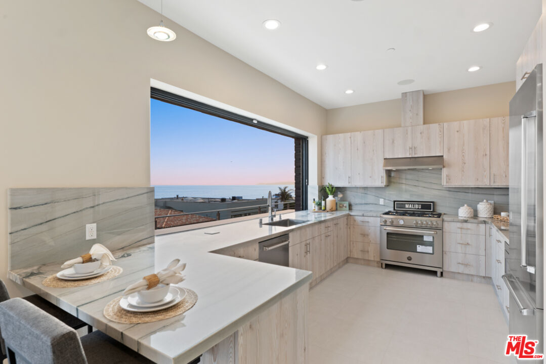 Expansive Ocean and City Light Views