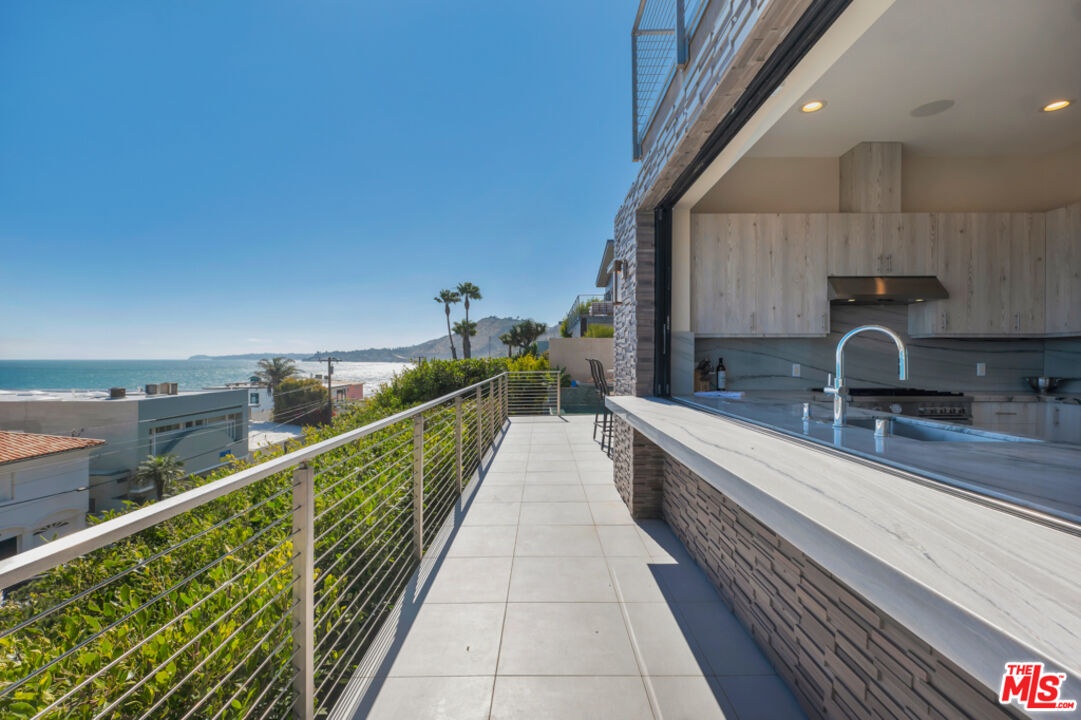 Expansive Ocean and City Light Views