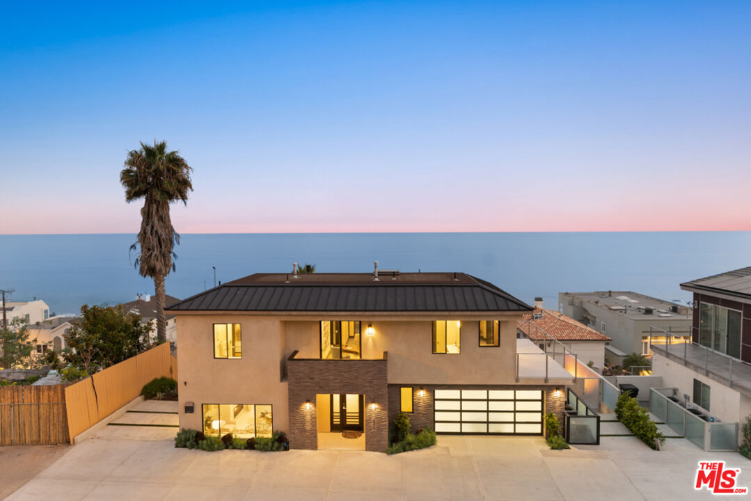 Expansive Ocean and City Light Views