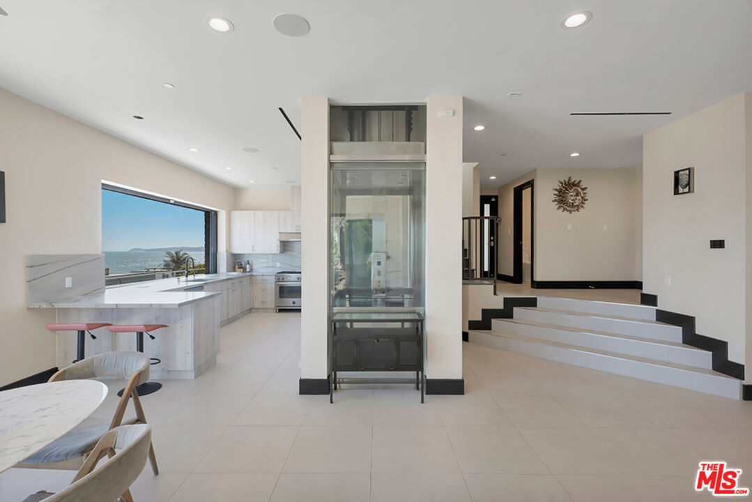 Expansive Ocean and City Light Views