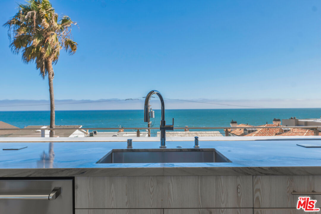 Expansive Ocean and City Light Views