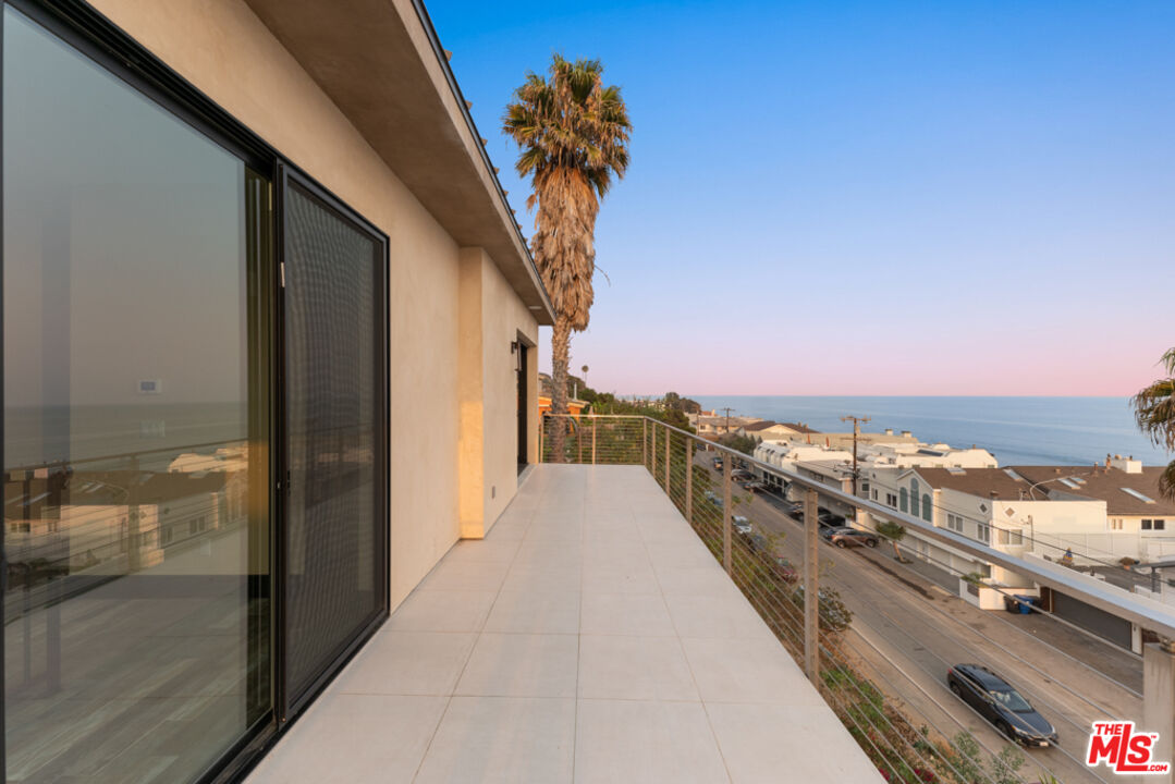 Expansive Ocean and City Light Views