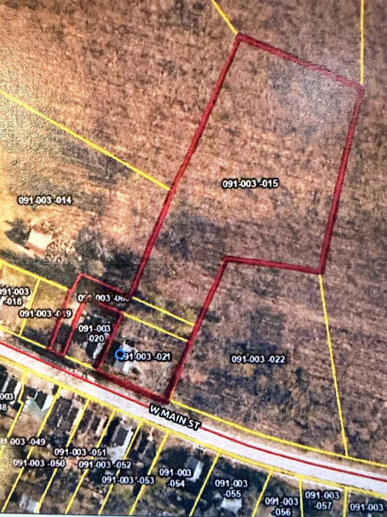 Parcel map highlighting lot 091-003-015 along West Main Street.