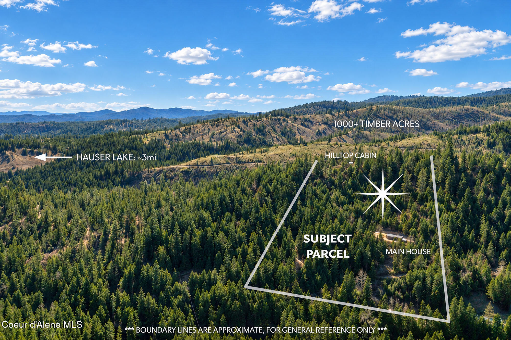 Forested property parcel with a main house and hilltop cabin, shown in an aerial view near Hauser Lake.