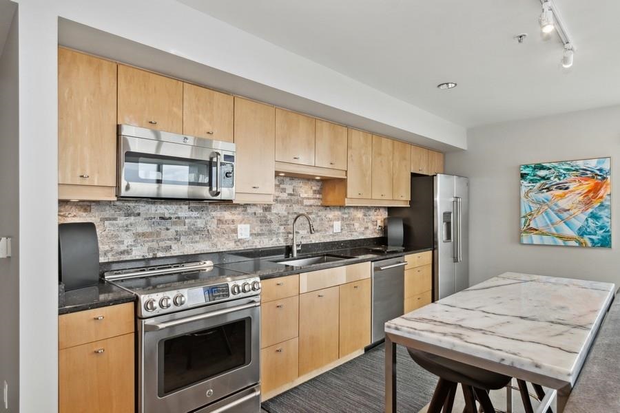 221 E College St Unit: 904