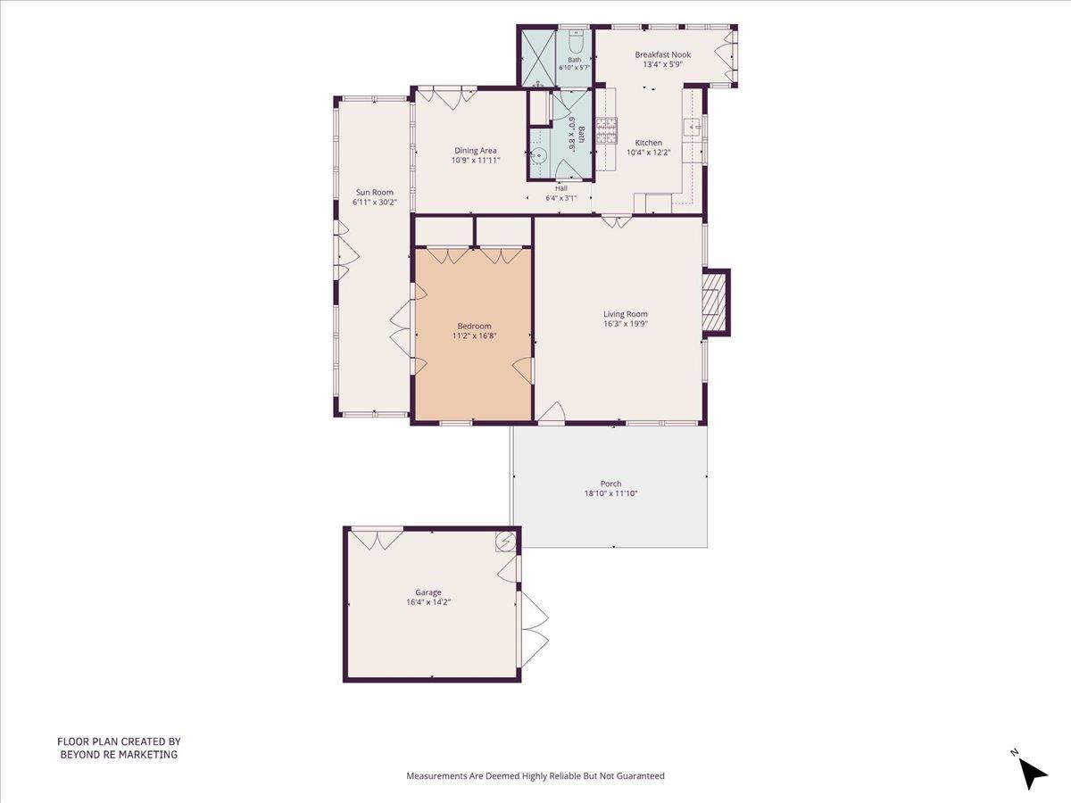 One-bedroom floor plan with a sunroom, porch, garage, kitchen, dining area, and living room.