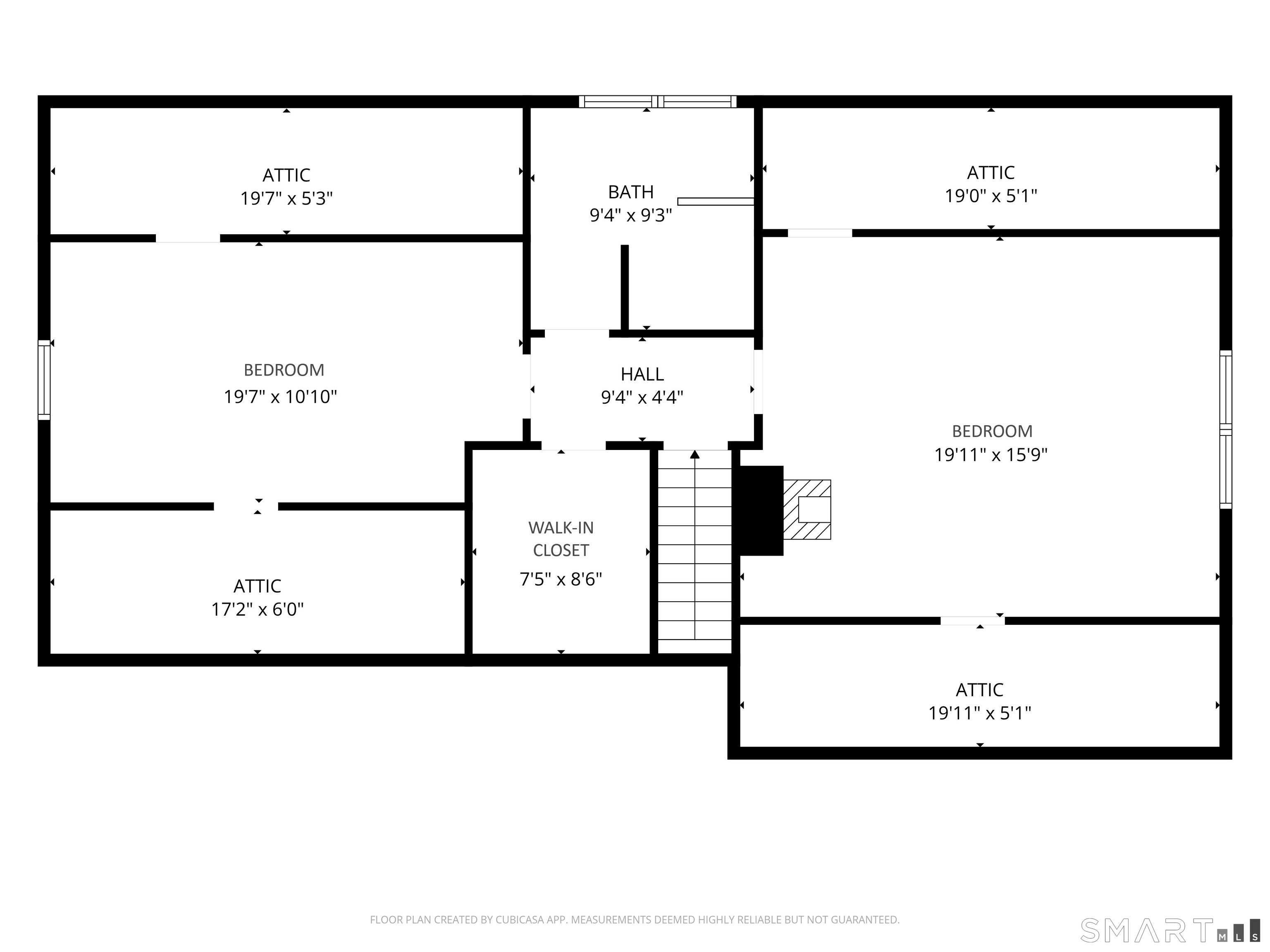 Upper-floor plan showing two bedrooms, a bathroom, hall, walk-in closet, stairs, and attic spaces.
