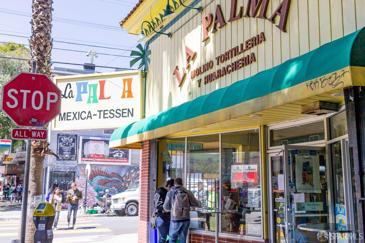 La Palma storefront with a teal awning on a sunny San Francisco street corner.