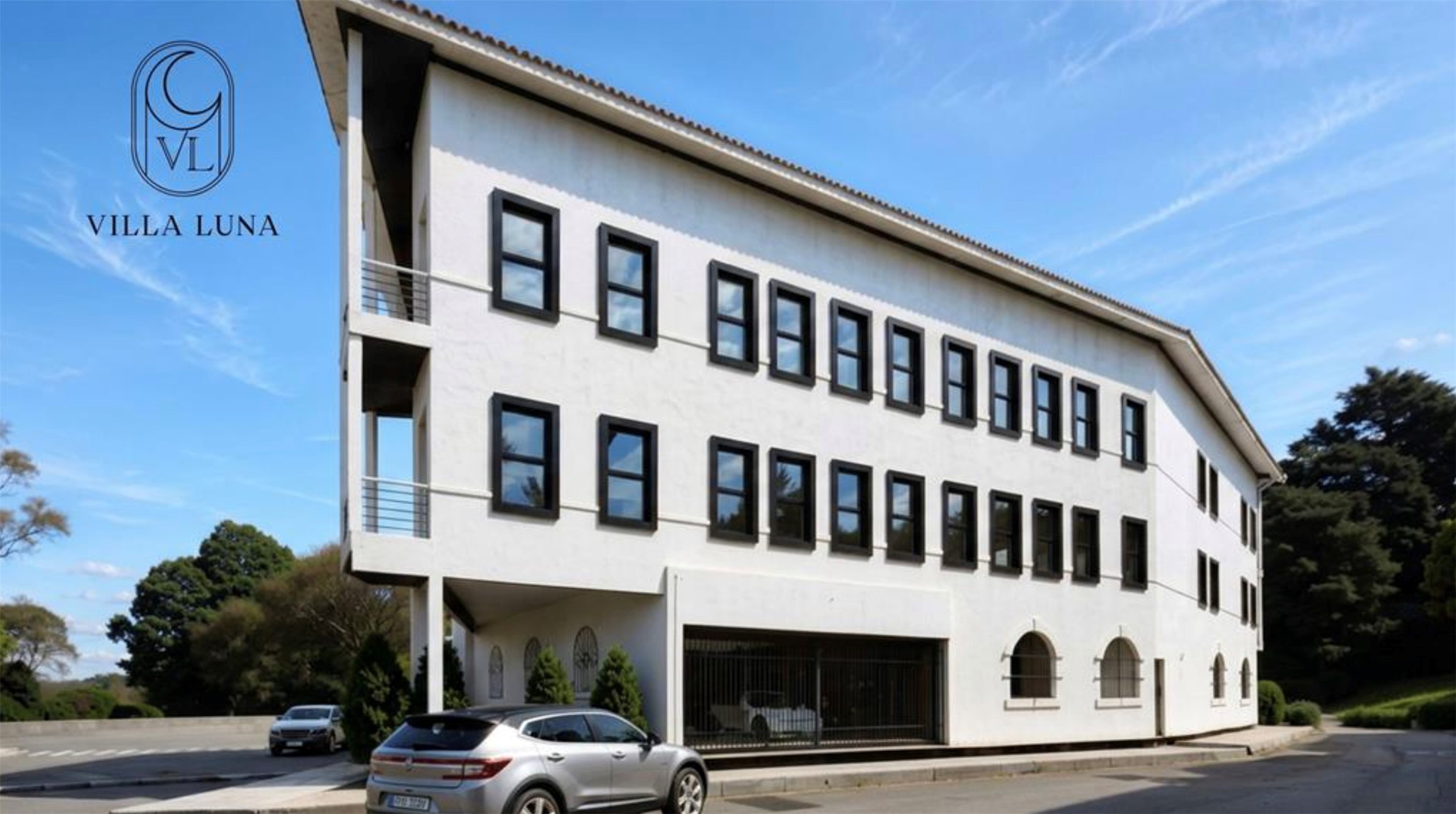 Villa Luna’s white multi-story building with black-framed windows and arched ground-floor openings.