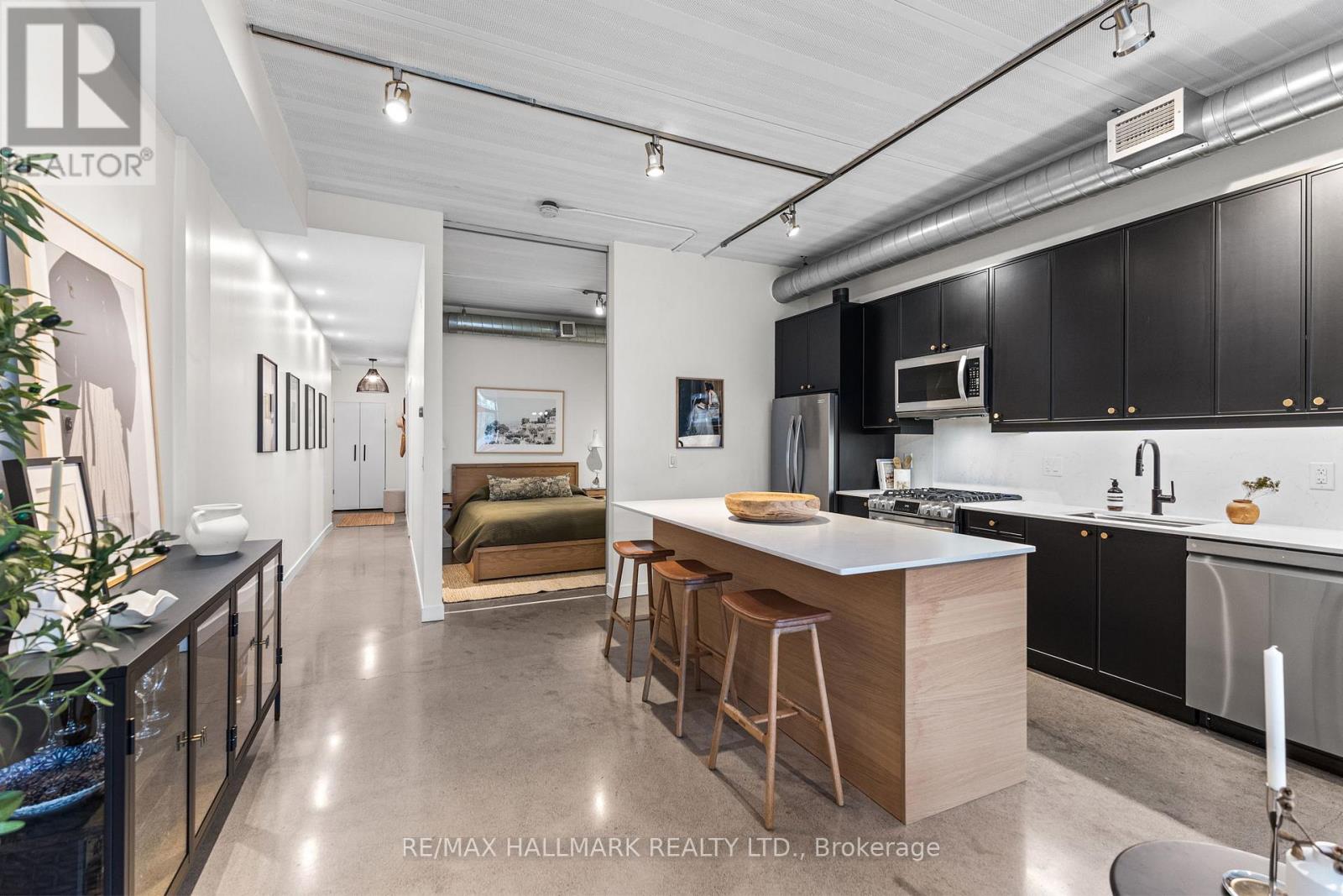 202 - 747 QUEEN STREET E