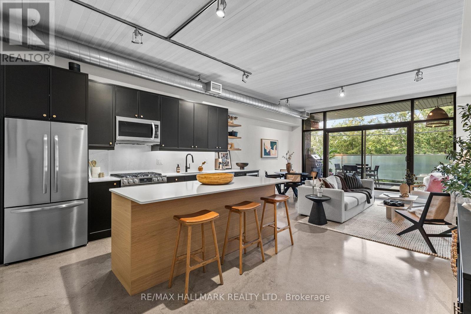 202 - 747 QUEEN STREET E