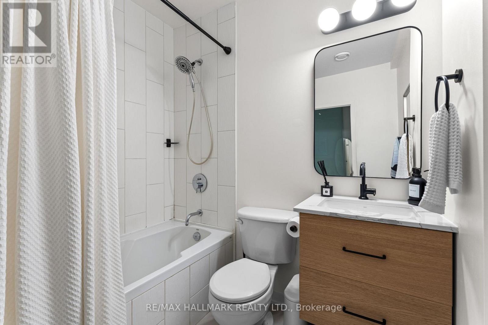 202 - 747 QUEEN STREET E