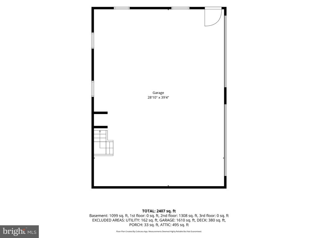 Garage floor plan with a staircase, perimeter windows, and a door at the upper right.