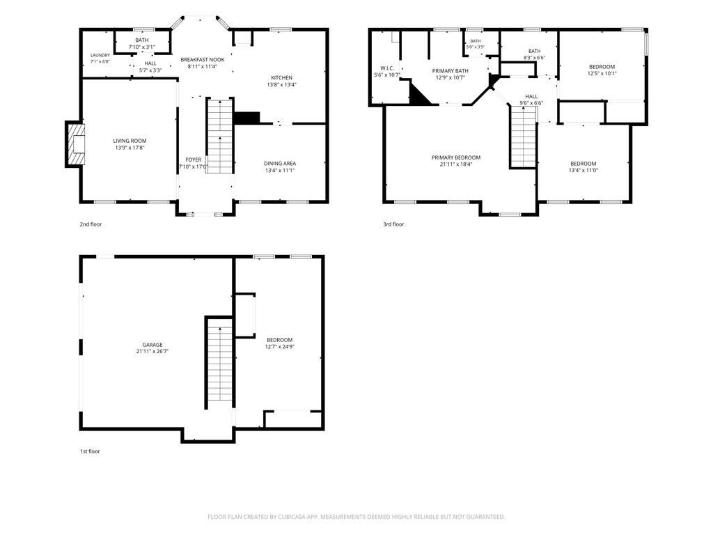 Three-level floor plan with a garage, living and dining areas, kitchen, bedrooms, and bathrooms.