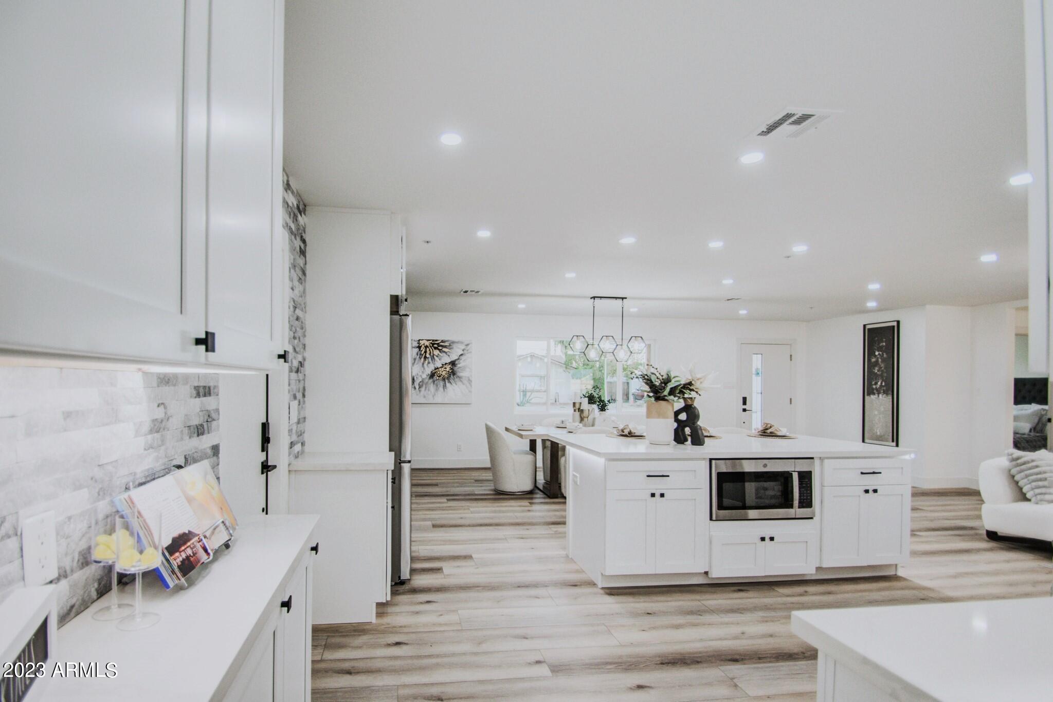 7002 E LATHAM Street