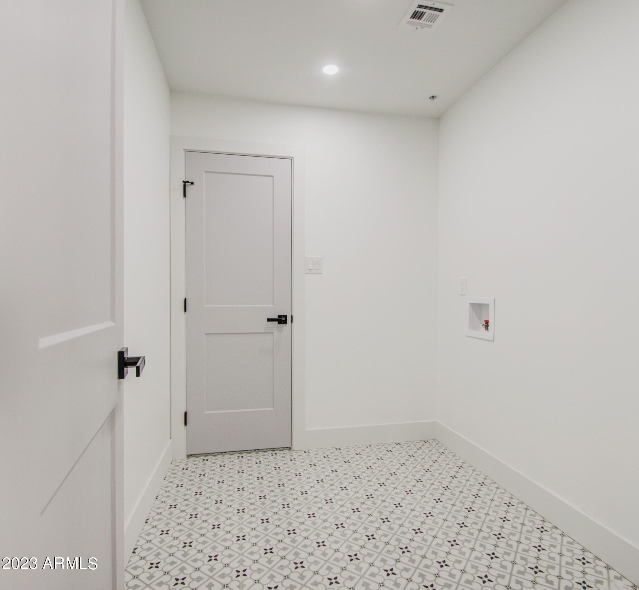 7002 E LATHAM Street