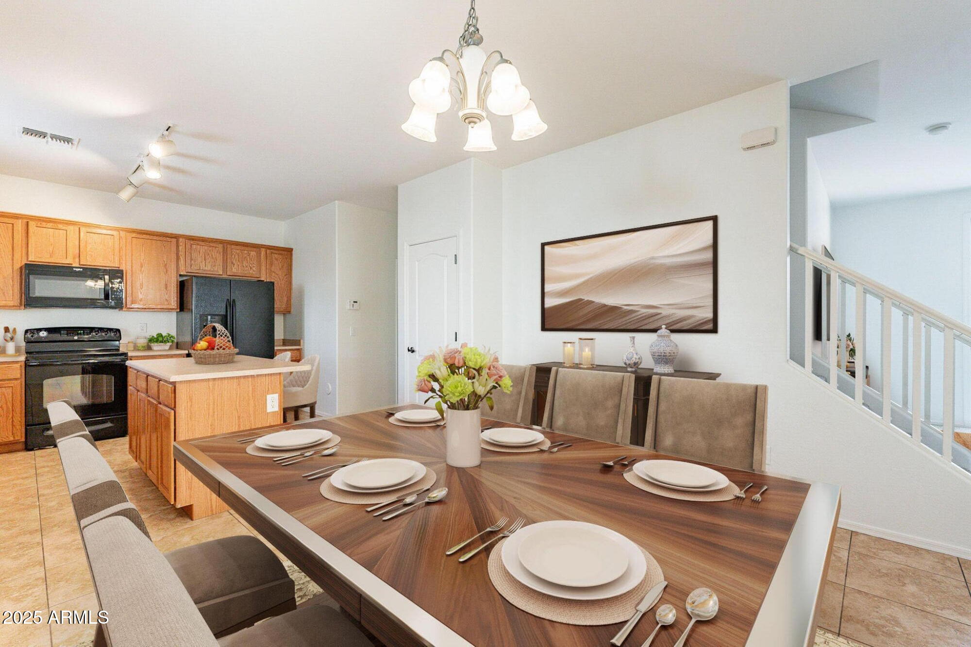 Open-plan kitchen and dining area with wood cabinets, a central island, and a set dining table.