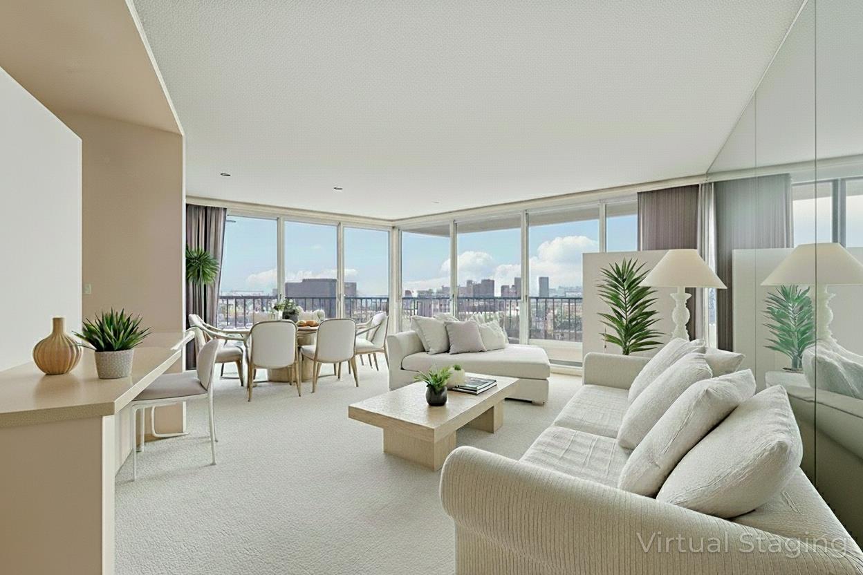 Open-plan living and dining room with cream furnishings and floor-to-ceiling windows overlooking the city.