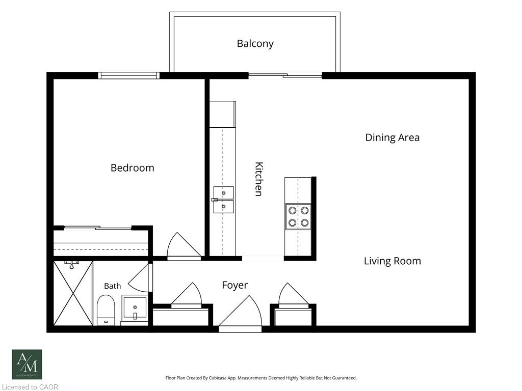 Floor plan showing a one-bedroom unit with a balcony and open living, dining, and kitchen area.