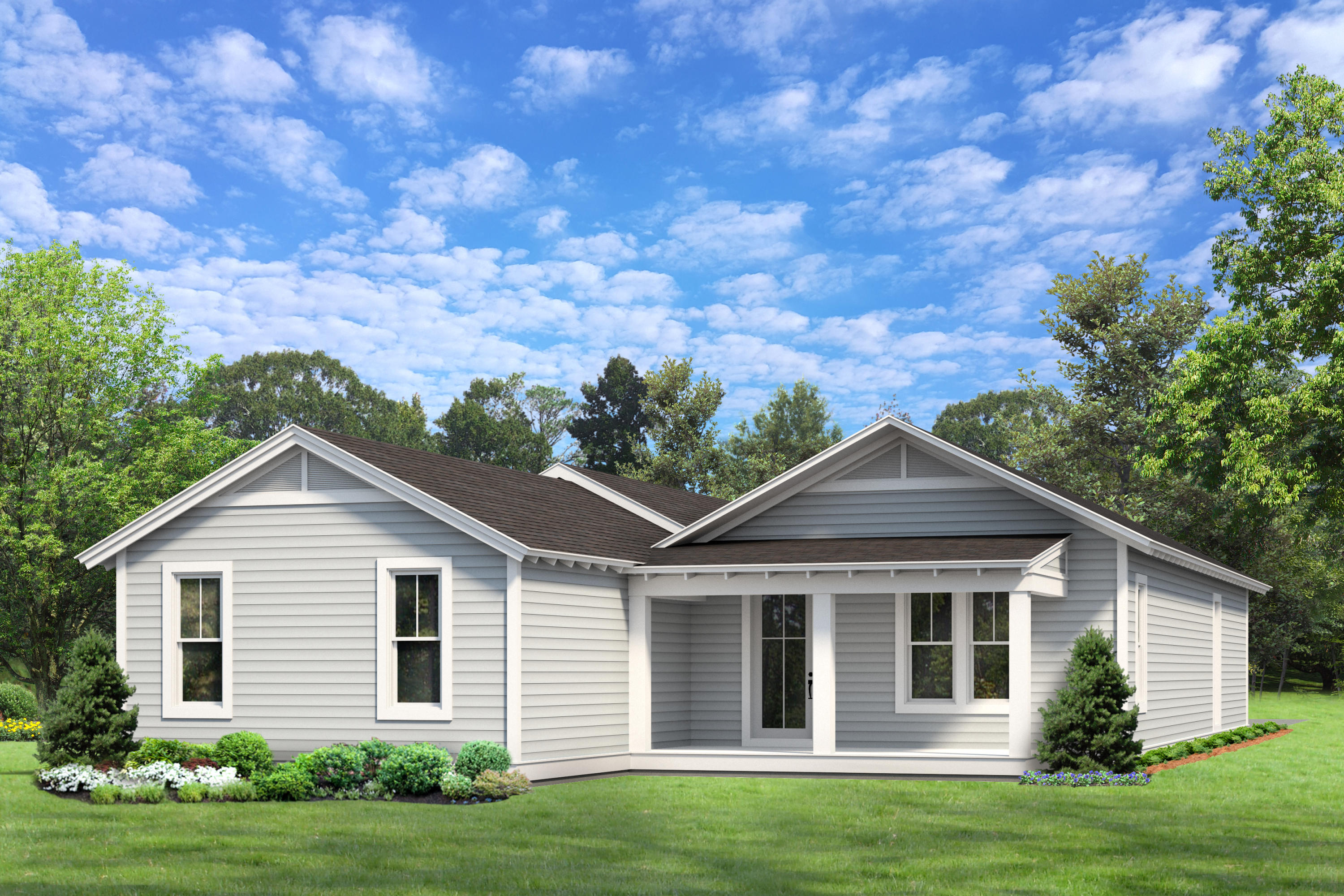 Single-story gray-sided house with a covered entry, landscaped flower beds, and a green lawn.