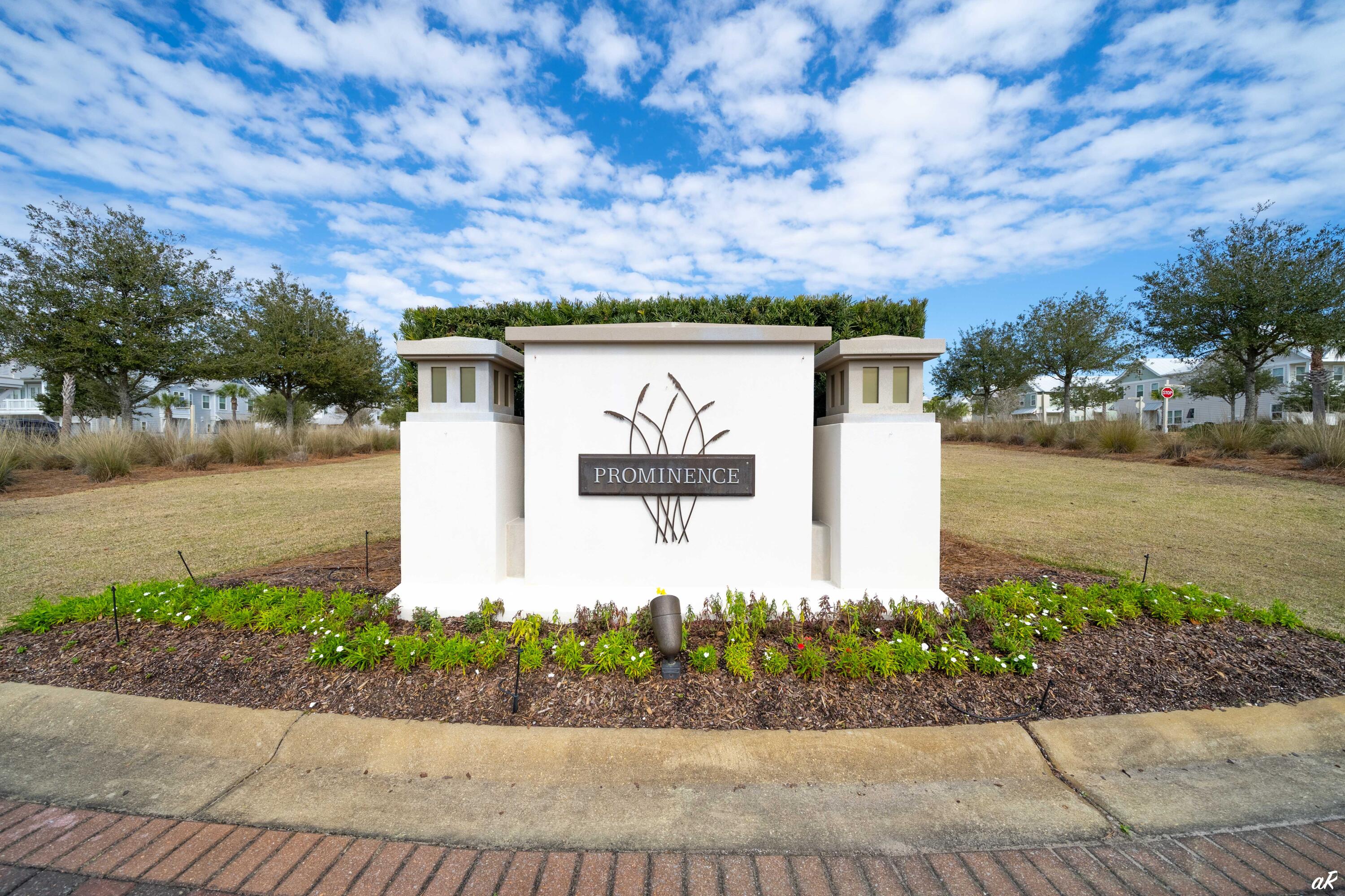 Prominence community entrance sign amid landscaped grounds.