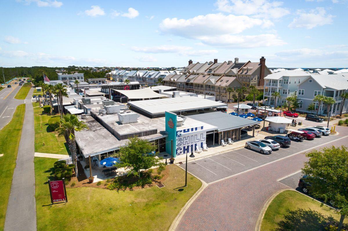 Aerial view of a commercial building with a CHILL storefront sign and parking area.