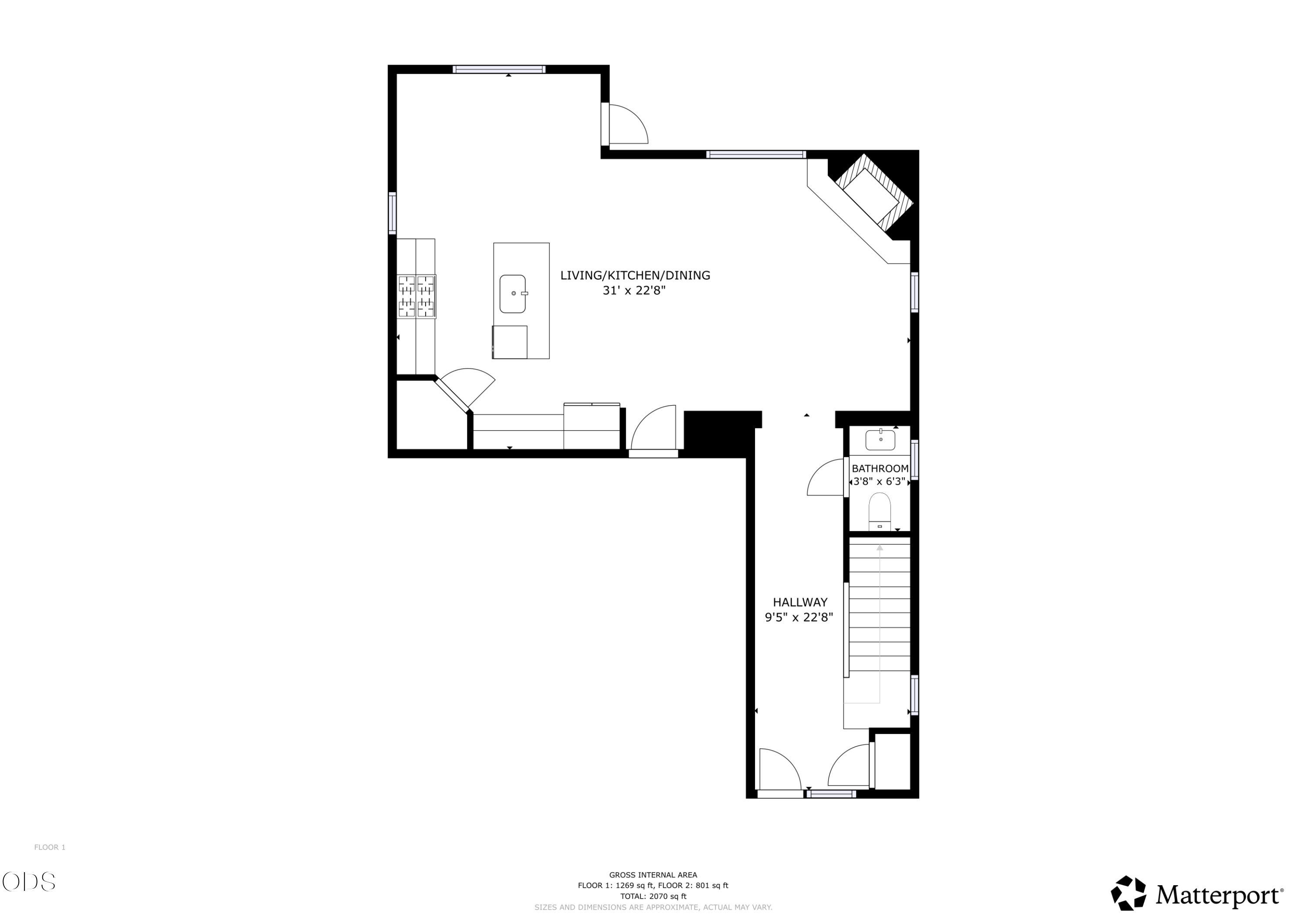Floor plan showing an open living, kitchen, and dining area, hallway, bathroom, and stairway.
