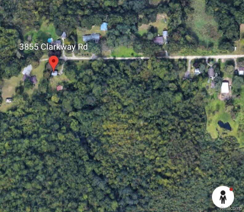 Aerial view of wooded property along Clarkway Road, marked with a location pin.