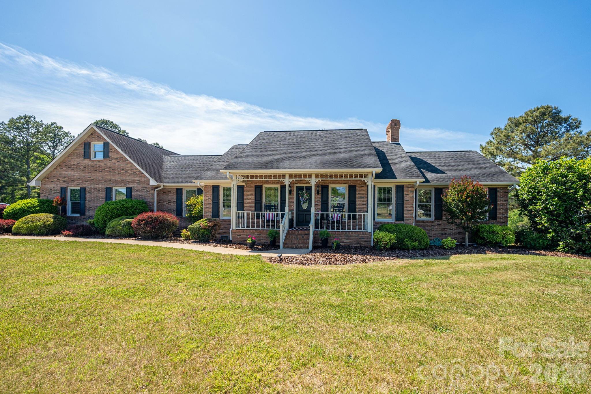 Brick home at 1327 Startown Road with a covered front porch and broad lawn.