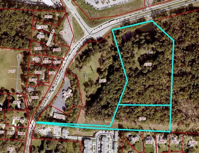 Parcel map highlighting a large wooded tract beside Canyon Road and Joomer Street.