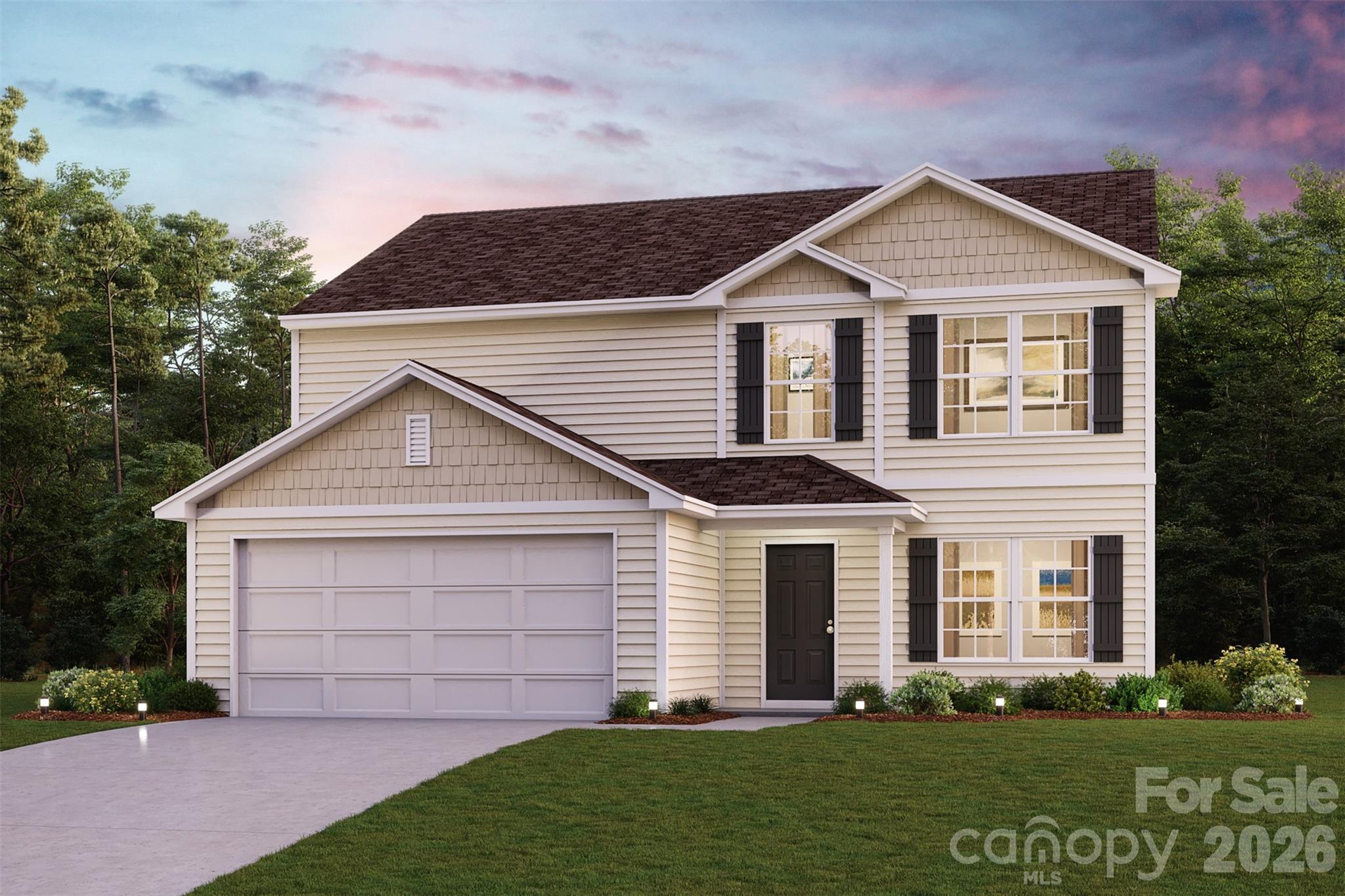 Two-story beige house with dark shutters, a two-car garage, and a landscaped front lawn at dusk.