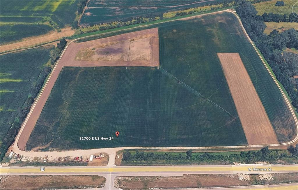 Aerial view of cultivated farmland bordered by roads, with a location marker near U.S. Highway 24.