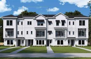 Modern white multi-unit townhomes with balconies and landscaped front lawns.