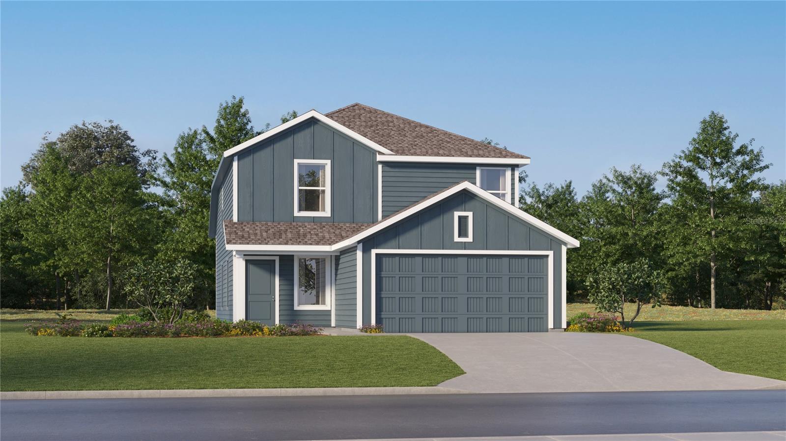 Two-story blue-gray house with white trim, a double garage, and a curved driveway.