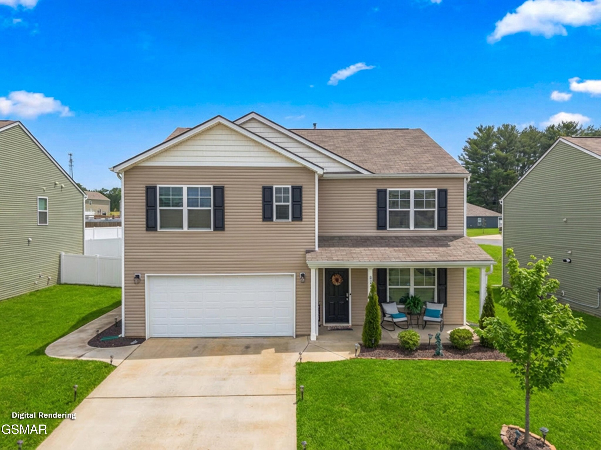 Two-story tan-sided home with a double garage, covered porch, and green lawn.
