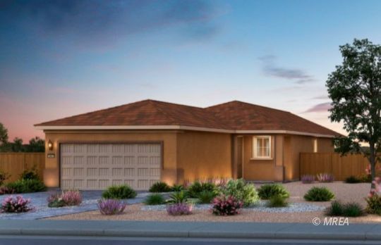 Single-story tan home with a two-car garage and desert landscaping at dusk.